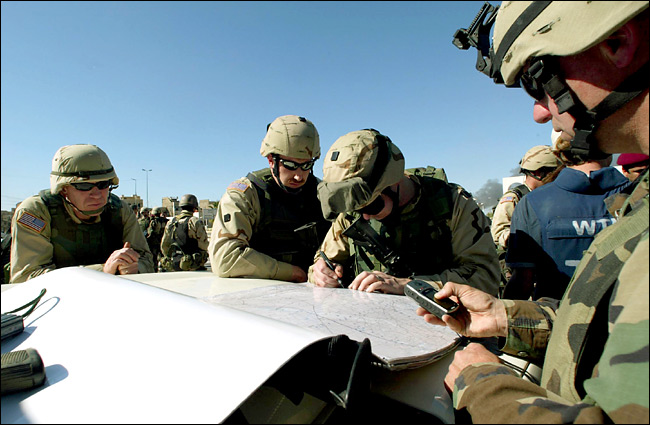 Special Operations soldiers revise plans before entering Mosul, April 11, 2003.
